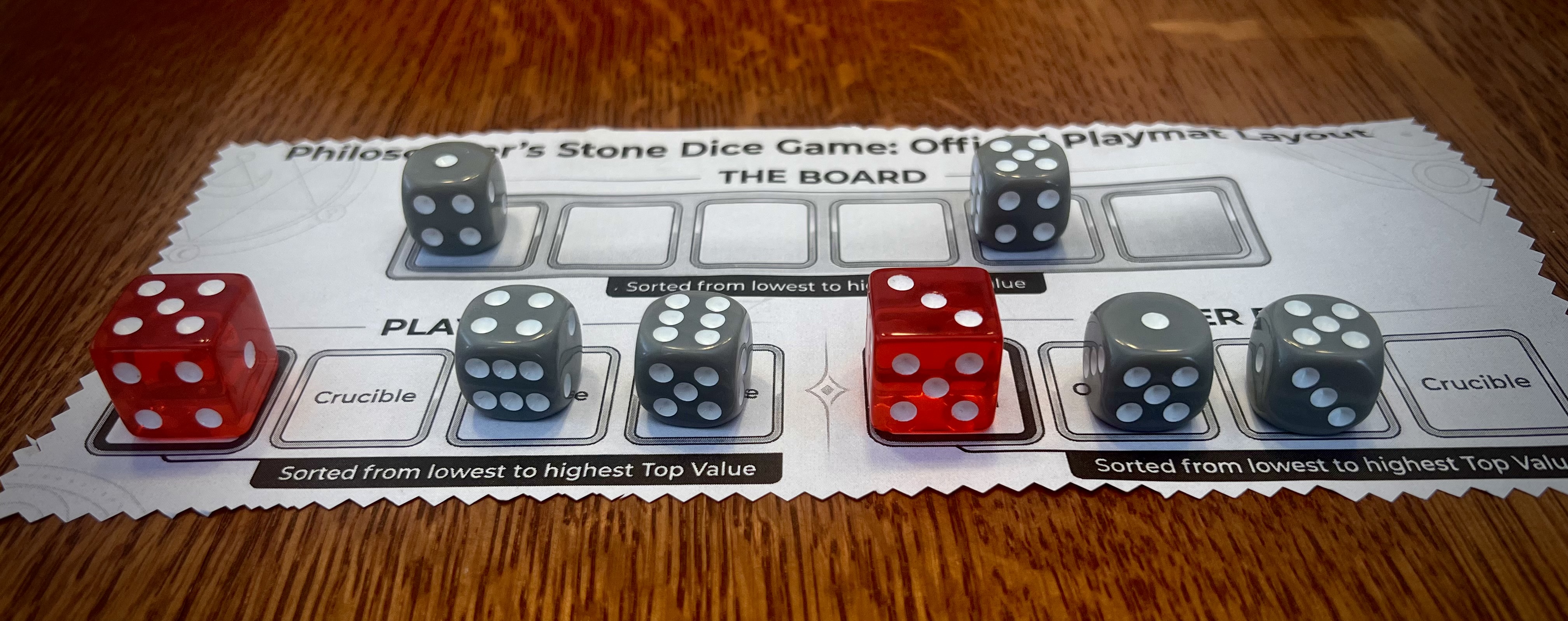 PSDG oak playmat with dice: six board dice and Red Crystal dice.